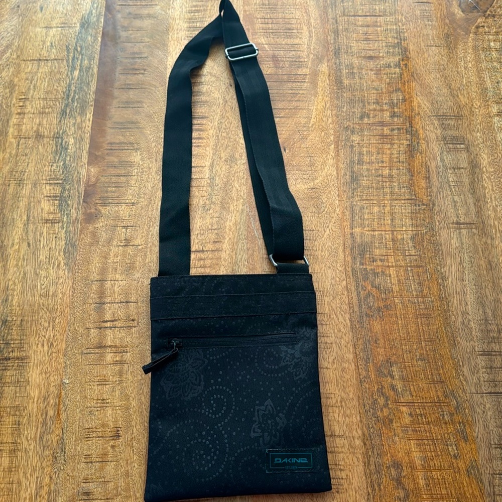Black crossbody purse, small size.